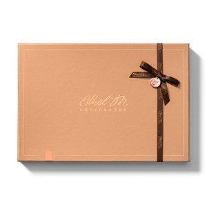 Mix and Match chocolate pieces with our reimagined packaging with complementing colored satin ribbons and charm sealed with Ethel M&#39;s monogram.