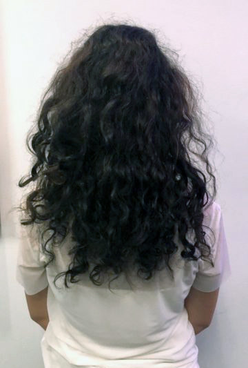 Naturally curly hair with straight outlet extensions