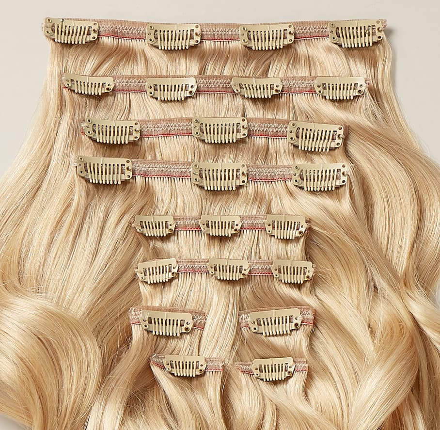 Close-up of a 10 piece set of Beyond hair extensions clip side up
