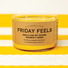 image Friday Feels 2 Wick Candle on a yellow and white cloth background image