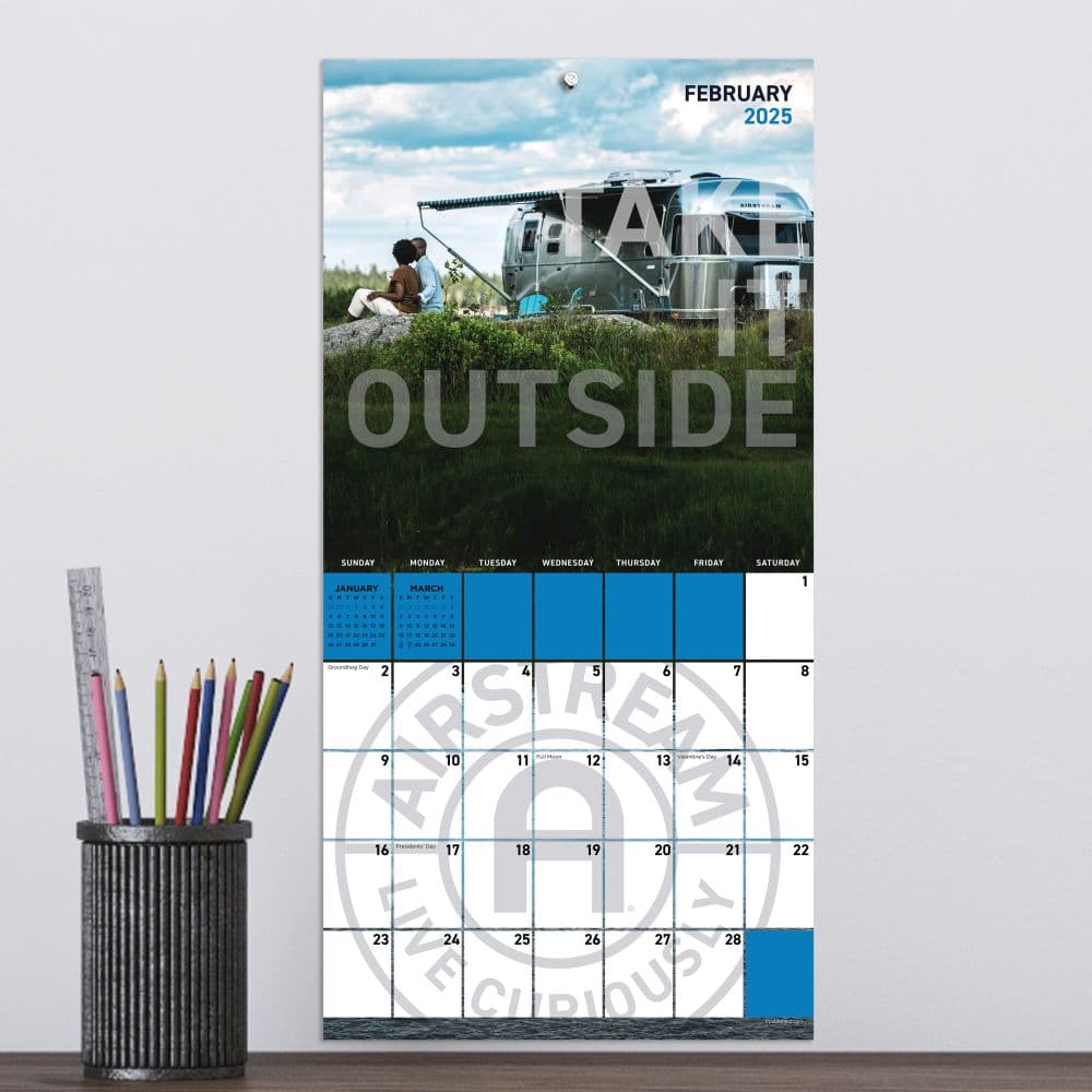 Airstream 2025 Mini Wall Calendar on a wall