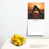 image Yoga Silhouettes Brush Dance 2025 Wall Calendar on a wall