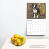 image Boston Terriers Deluxe 2025 Wall Calendar on a wall