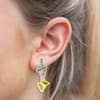 image Butterfly Mushroom Flower Dangle Earrings Silver on a model