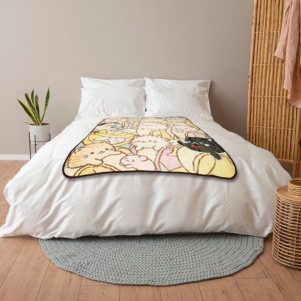 Bananya Family Blanket on a bed