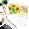 image Live Love Laugh 2025 Wall Calendar on a desk