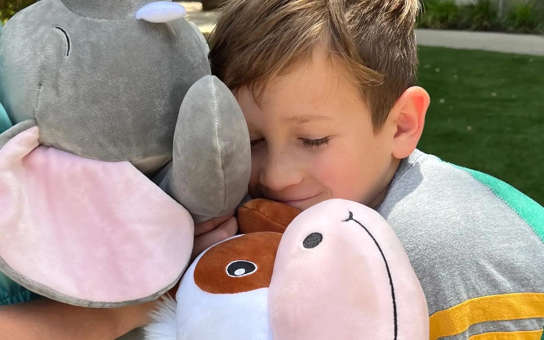 Boy hugging Snoozimals