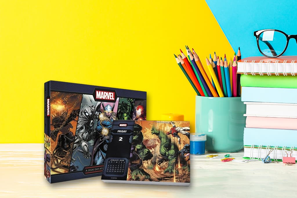 Desk calendar in a school supply workspace with notebooks and pencils — part of a complete desk setup