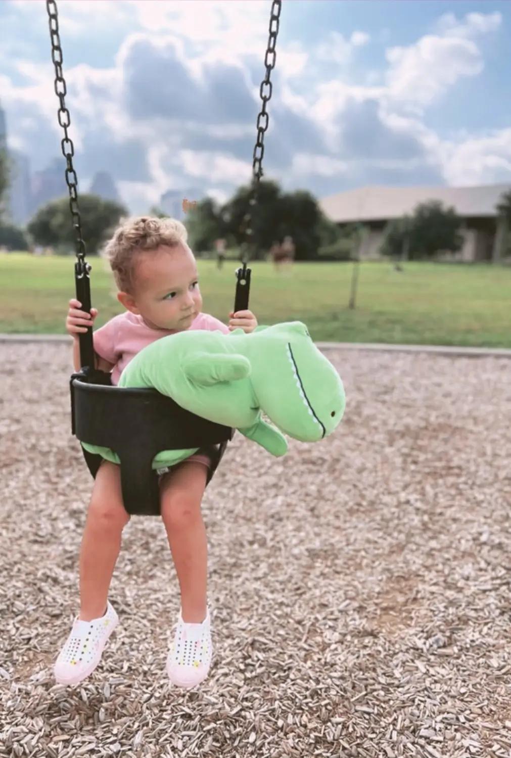 Kid on swing with Snoozimal